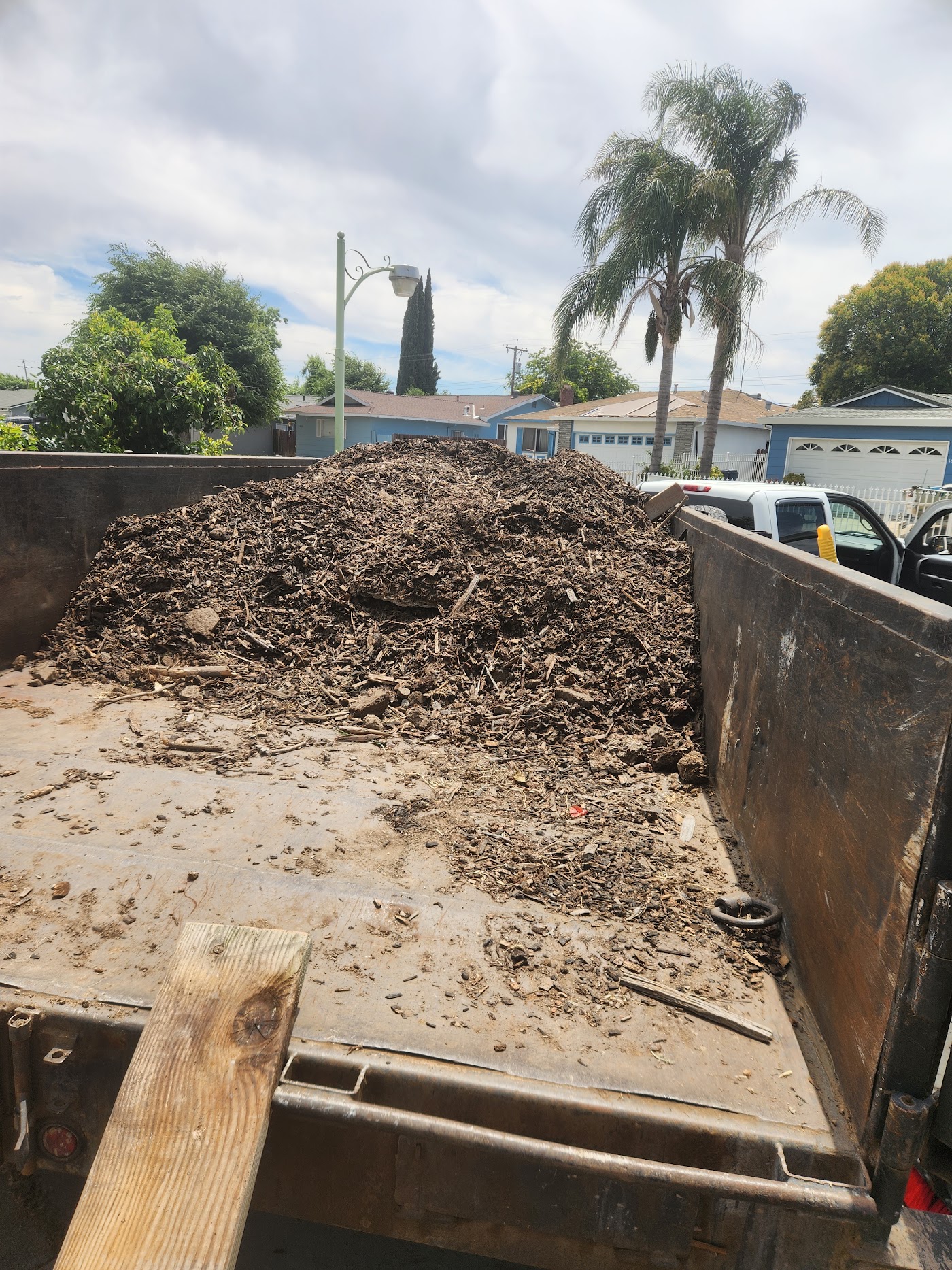 Dump trailer filled with dirt and construction debris
