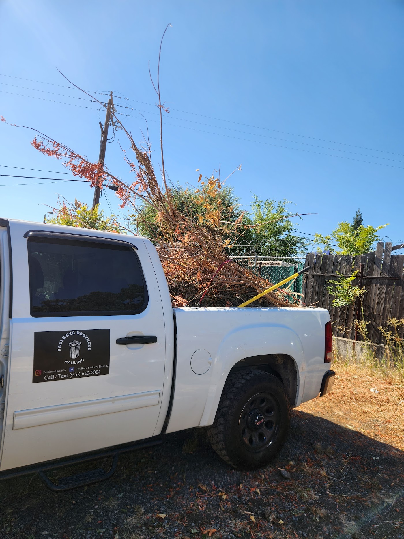 Faulkner Brothers truck loaded with cut tree limbs