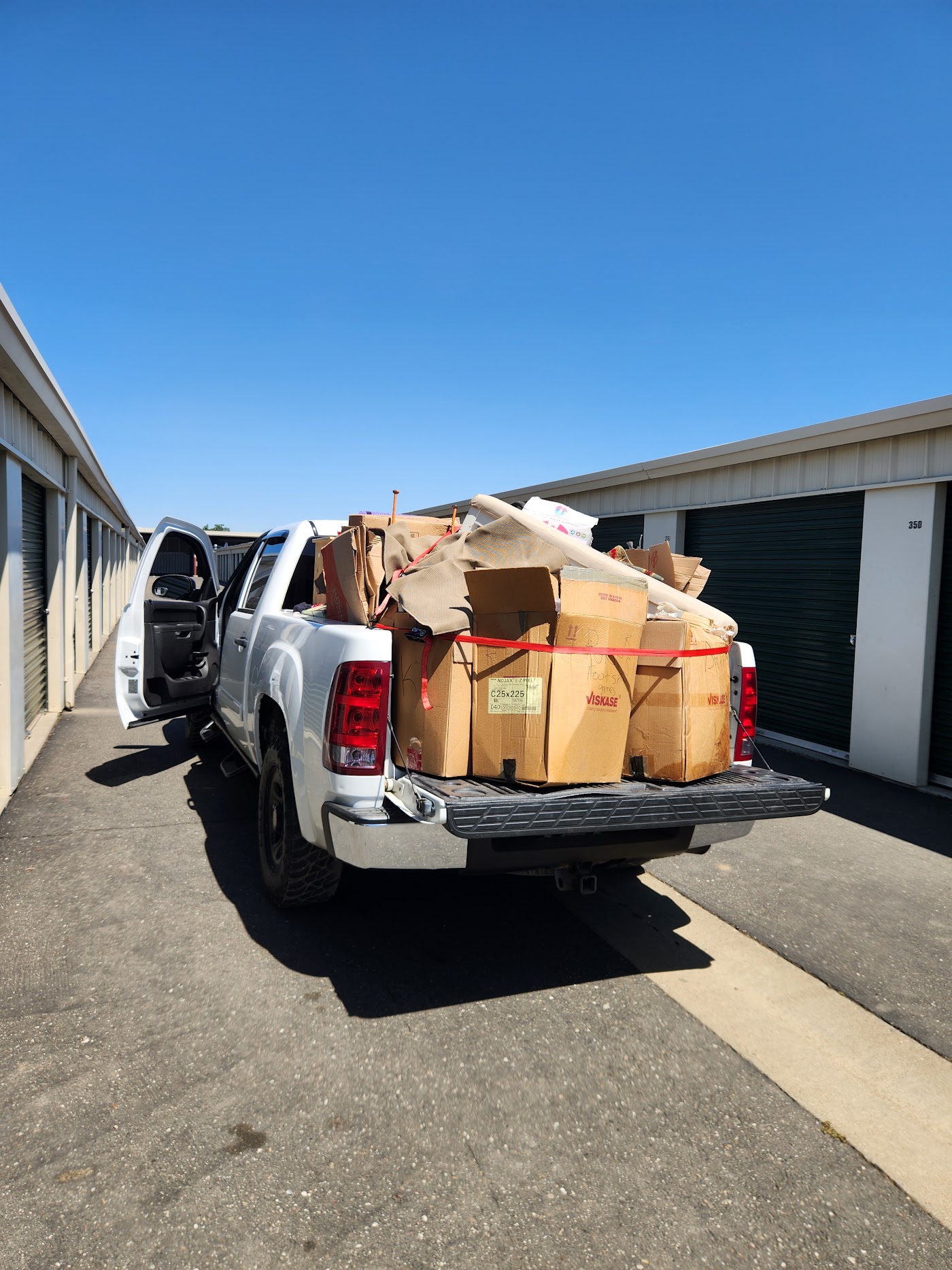 Truck loaded with moving boxes outside a storage unit